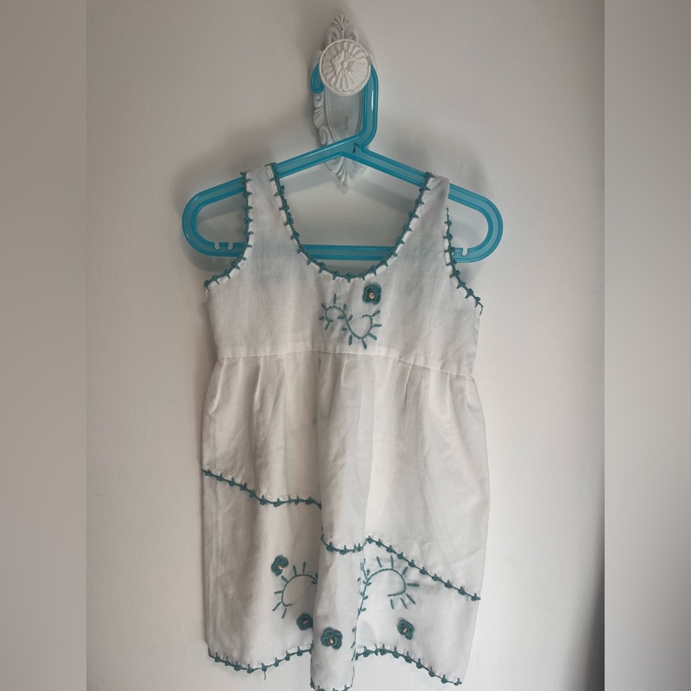 White Sleeveless dress with Blue Embroidery.